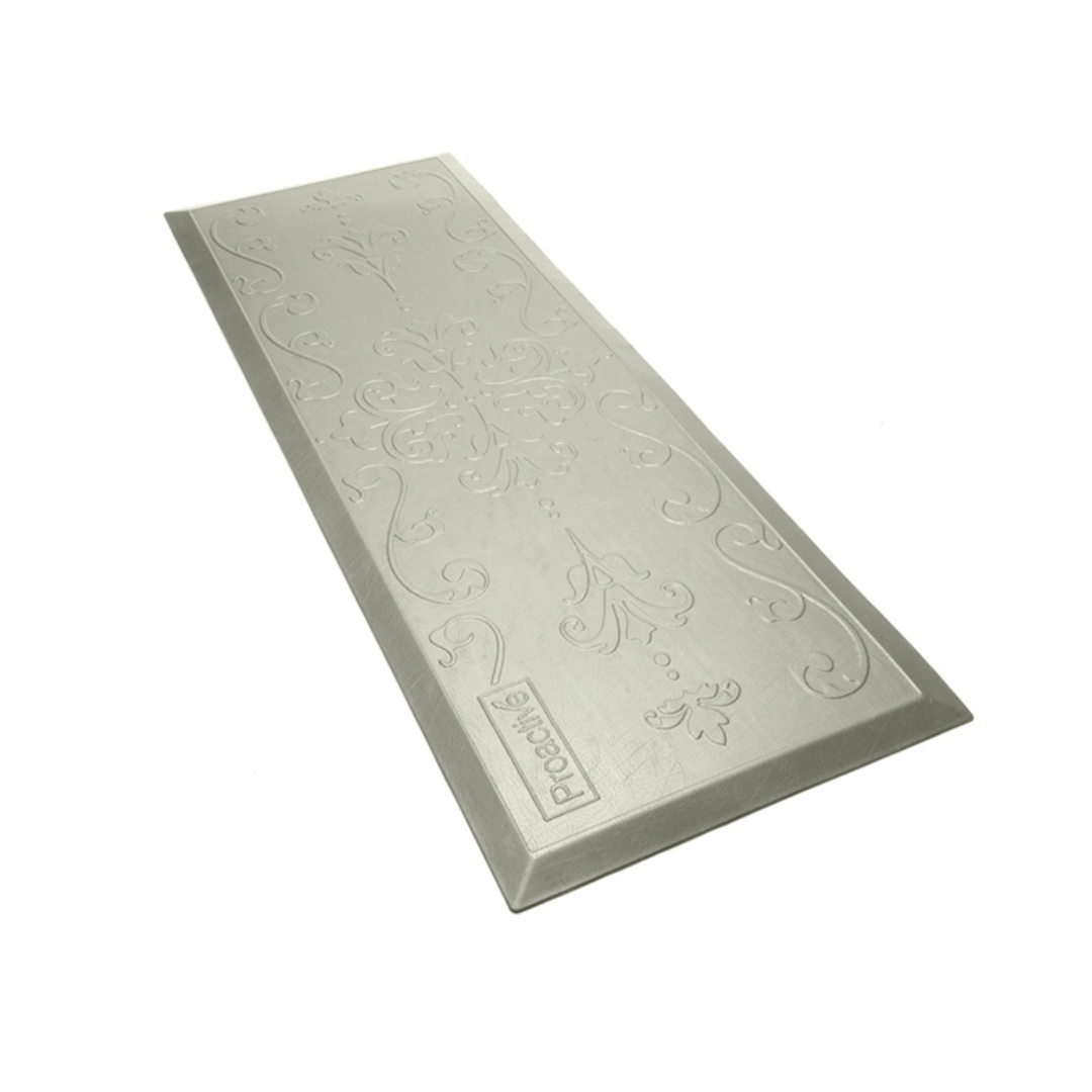 The Proactive Protekt® Beveled Fall Cushioned Floor Mat is a white, rectangular, impact-resistant mat with a subtle pattern designed to blend seamlessly into any space.